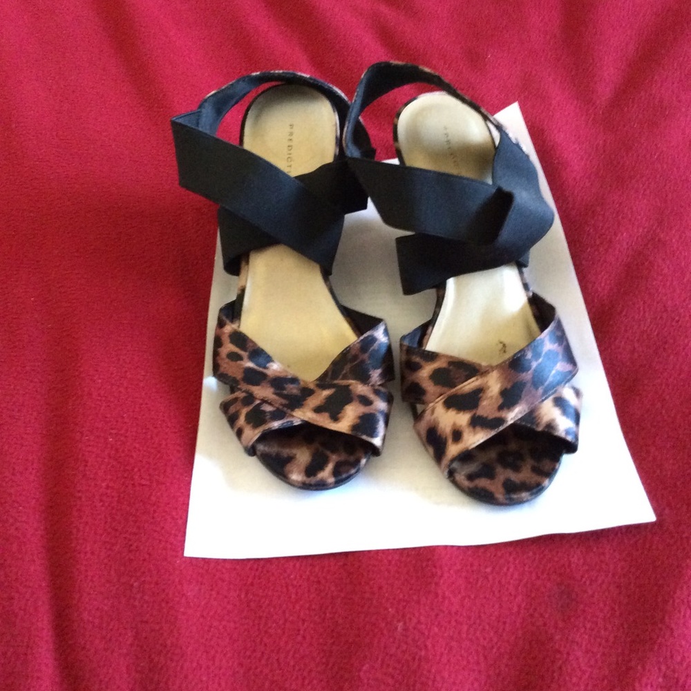 Used cheetah print wedges with elastic cross band